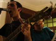 College alumnus Dan Fishback and College senior Sara FitzSimmons sing and play in the five-person Dan Fishback Band -- formerly known as Cheese on Bread -- at the Kelly Writers House on Saturday evening.
